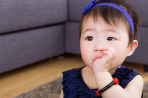 baby sitting on carpet